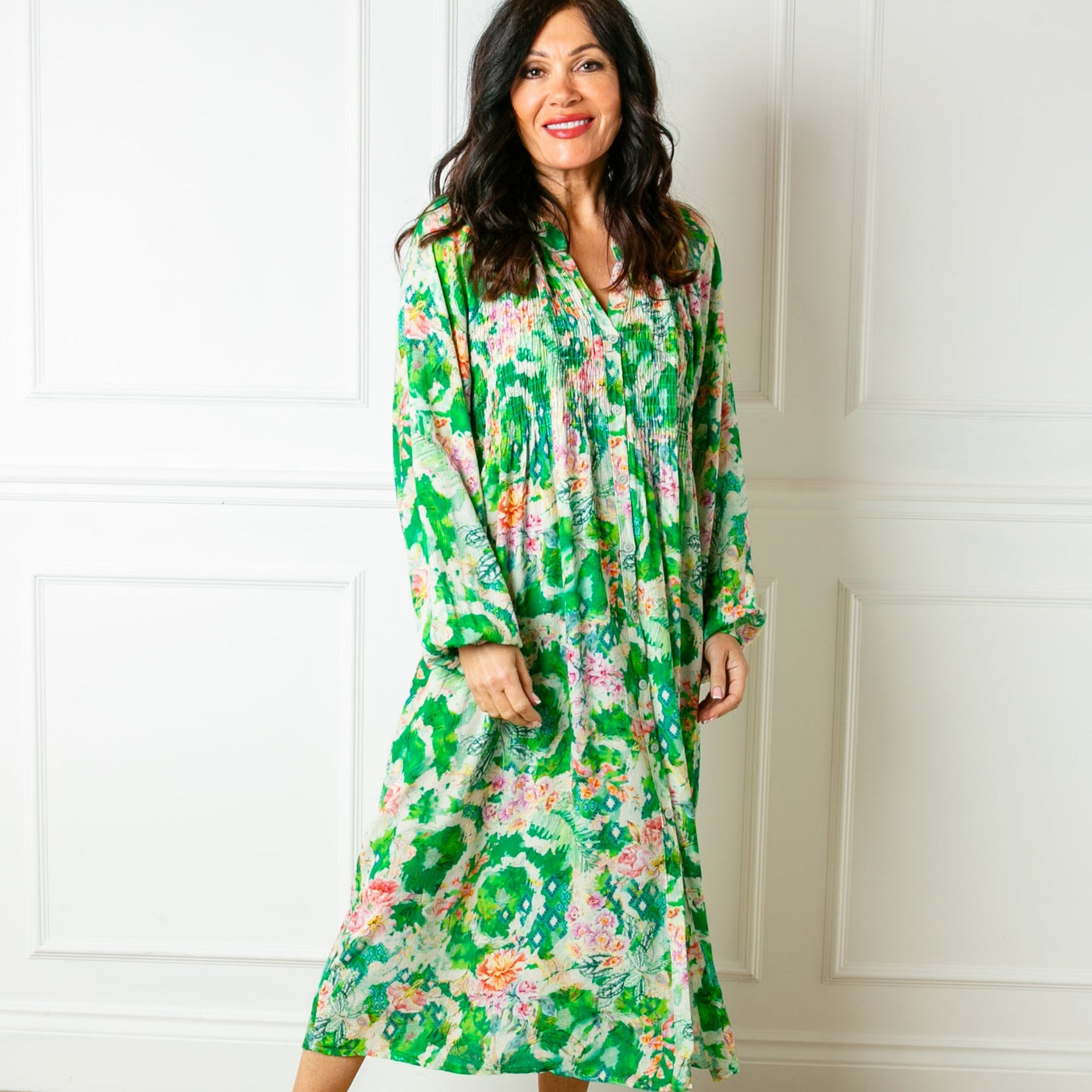 The green Wild Garden Maxi Dress with long balloon sleeves and a collarless v neckline